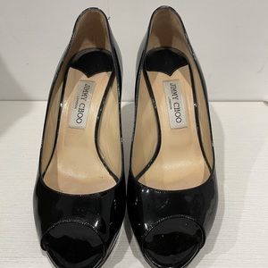 Jimmy Choo patent leather pumps in good condition.